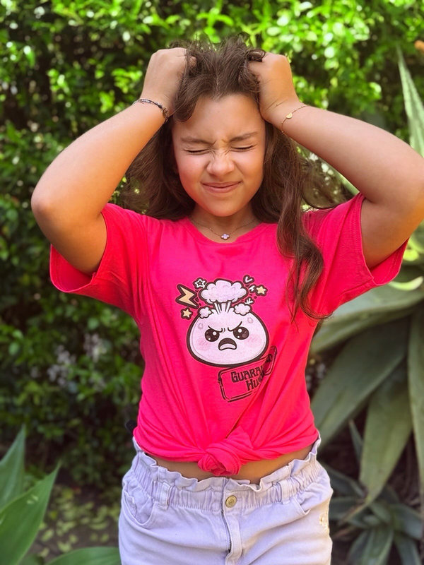 Laura, 12, 4'9" — She loses it in her “Fuming” t-shirt, size Youth M.