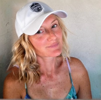 Jane, 5'7" — Sunkissed Jane, protected from the sun in our Signature Guaranteed Human™ cap in white.